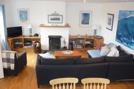 Lounge with open fire and comfy sofas