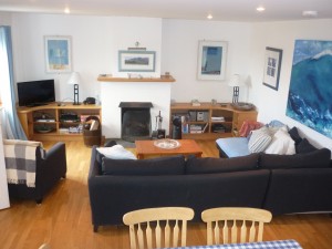 Lounge with open fire and comfy sofas