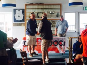 Race prize being presented to Anthony O'Leary by Jim Griffiths of Beacon Properties